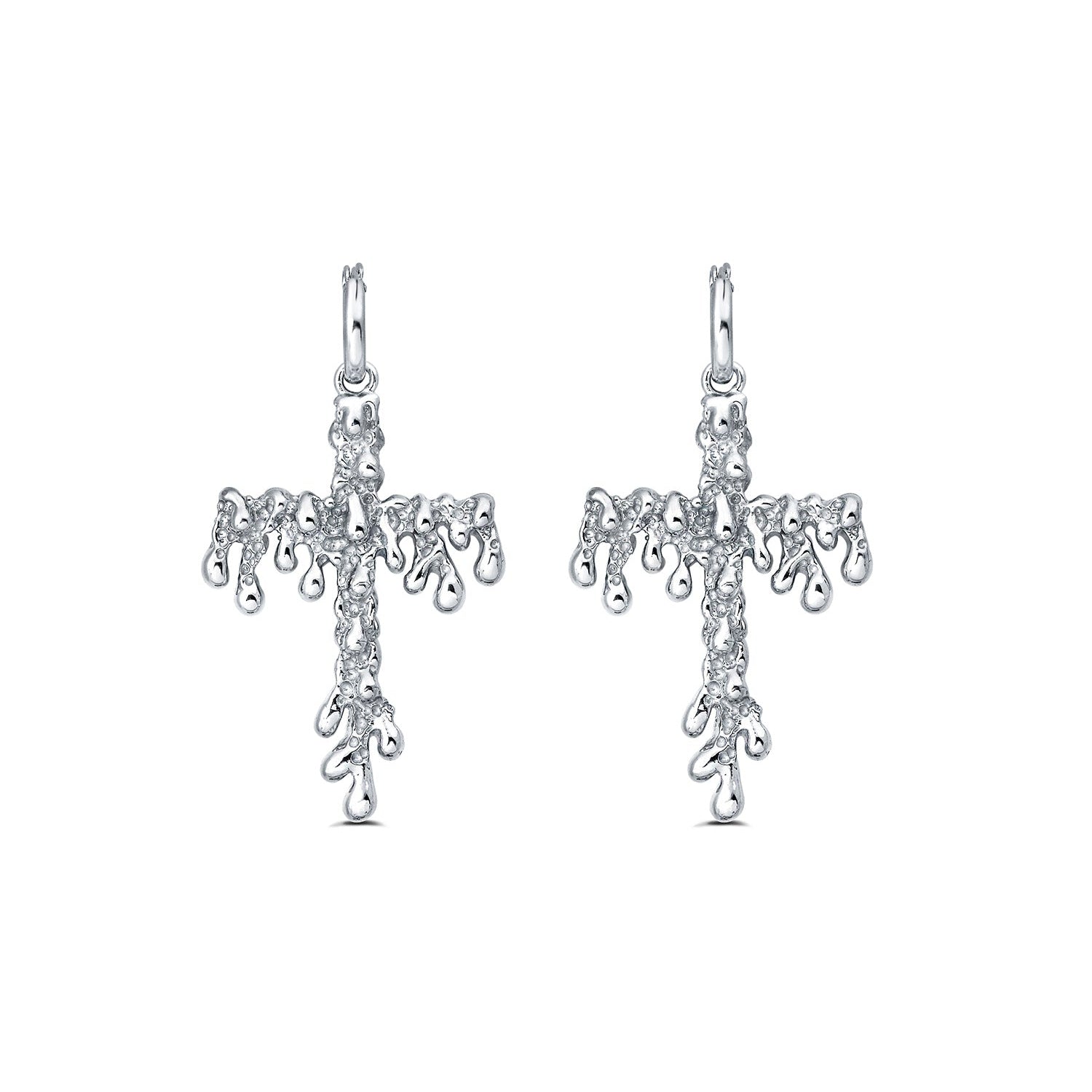 Pair of silver earrings with intricate designs on a white background