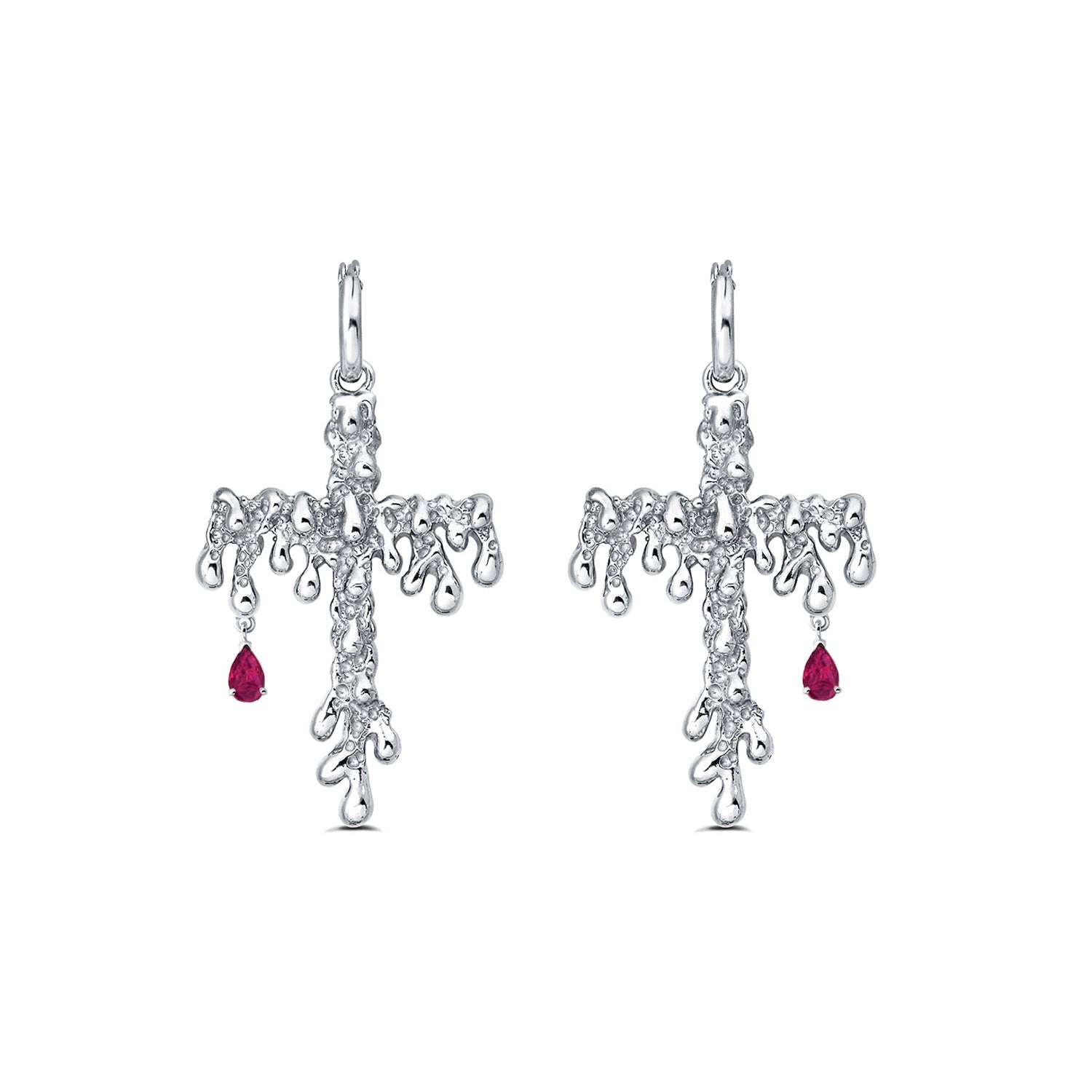 Silver cross-shaped earrings with red gemstones on a white background