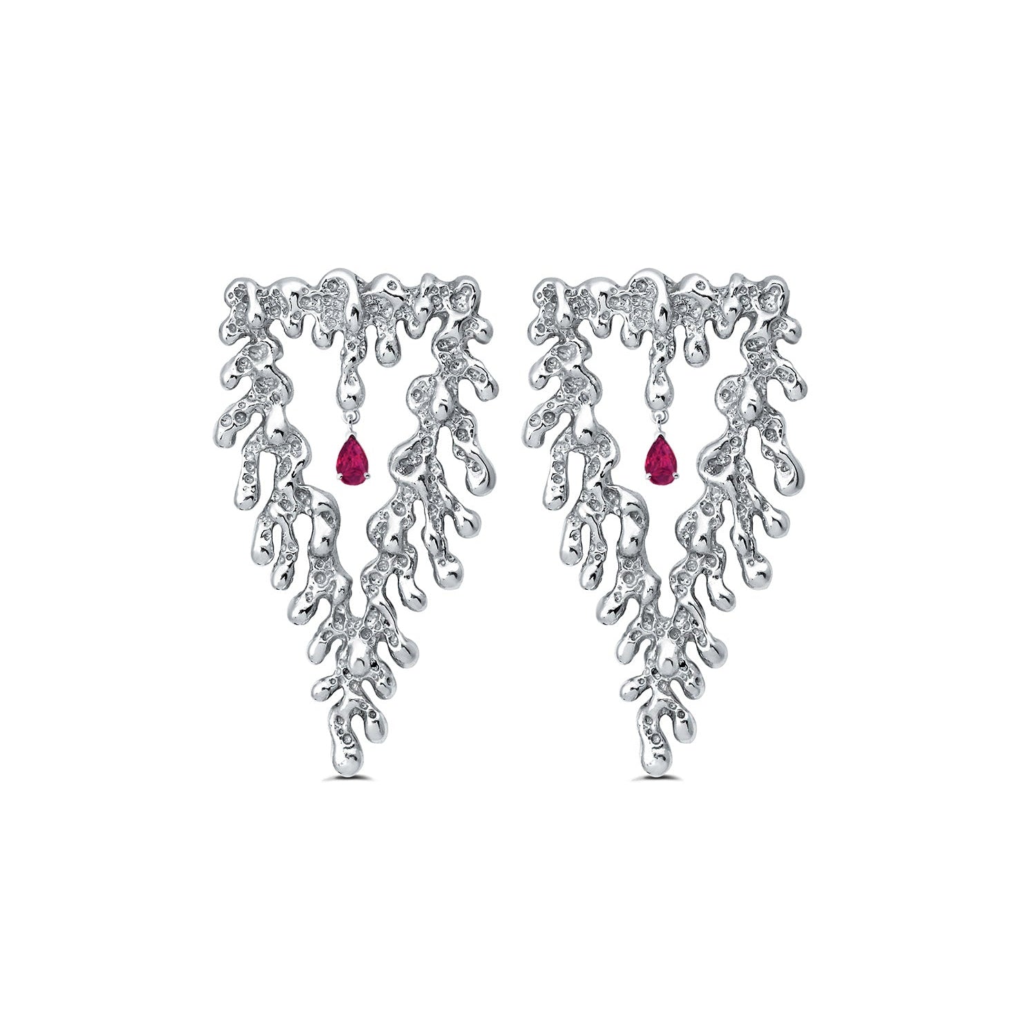Silver earrings with red gemstones on a white background